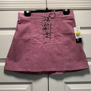 Corduroy mini skirt with self cord at front rise. Brand new with TAGS